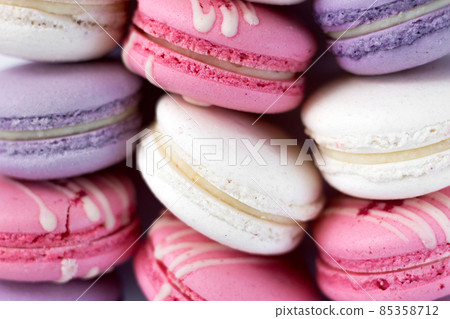 Pattern of macaroon dessert. Pastel pink and violet french pastry 85358712