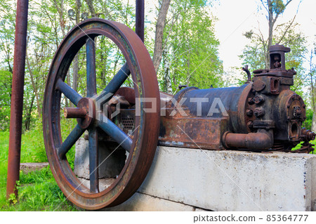 Old steaming threshing machine in Open air Museum of Folk Architecture and Folkways of Middle Naddnipryanschina in Pereyaslav, Ukraine 85364777