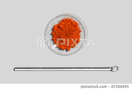 Closeup chemical ingredient on white laboratory table. Lead(II,IV) oxide in Chemical Watch Glass place next to stirring rod. Top View Closeup chemical ingredient on white laboratory table. Lead(II,IV) oxide in Chemical Watch Glass place next to stirring rod. Top View 85366895