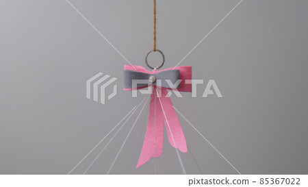 Cot mobile hanging felt bow and ring closeup Cot mobile hanging felt bow and ring closeup 85367022