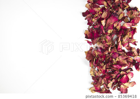 Close up shot of Dry rose petals background border,edge isolated on white background with copy space romantic wedding, Valentines Day design 85369418