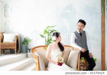 Bride and groom staring at each other Wide angle Bride and groom staring at each other Wide angle 85370424
