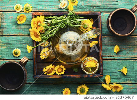 Glass teapot with flower tea,herbalism Glass teapot with flower tea,herbalism 85370467