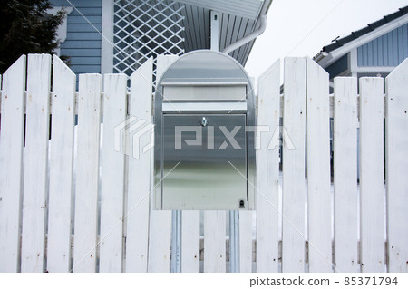 A silver outdoor mailbox at winter in Finland. A silver outdoor mailbox at winter in Finland. 85371794