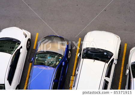 Colorful car parking lot inn modern condo resident aerial view 85371915