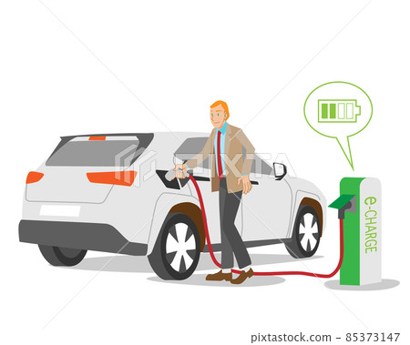 Caucasian male businessman charging an electric car Caucasian male businessman charging an electric car 85373147