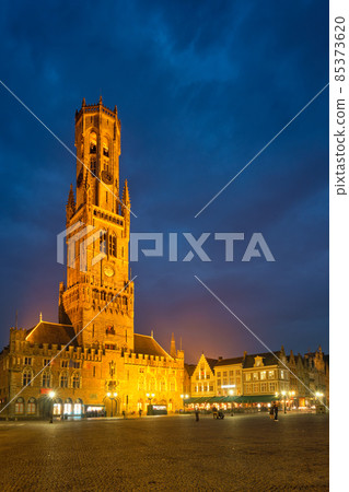 Belfry tower and Grote markt square in Bruges, Belgium on dusk in twilight 85373620