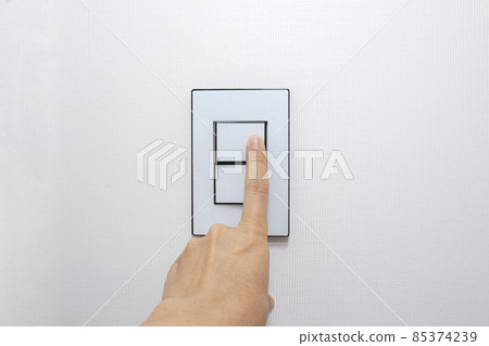 hand pushing a switch 85374239