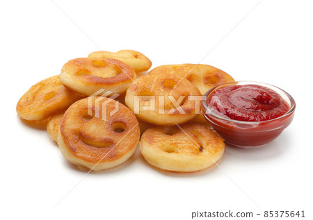 Homemade smiley face french fries with ketchup isolated 85375641
