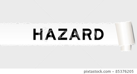 Ripped gray paper background that have word hazard under torn part 85376205