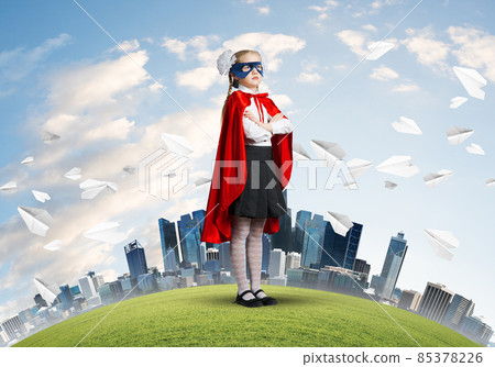 Girl power concept with cute kid guardian against cityscape background Girl power concept with cute kid guardian against cityscape background 85378226