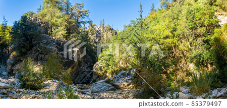 panorama of a mountain river bed in a wooded gorge in Taurus Mountains, southern Turkey panorama of a mountain river bed in a wooded gorge in Taurus Mountains, southern Turkey 85379497