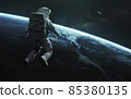 Astronaut at spacewalk orbiting Earth planet. Elements of image provided by Nasa 85380135