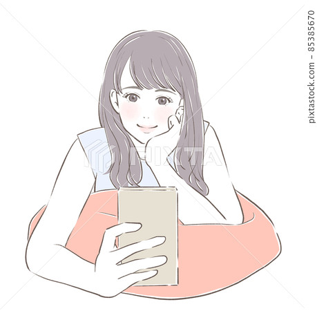 A girl who looks at her smartphone and laughs 85385670