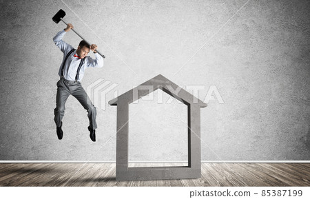Stone home silhouette in empty room as symbol for real estae insurance Stone home silhouette in empty room as symbol for real estae insurance 85387199
