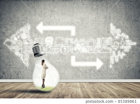 Businesswoman trapped in bulb Businesswoman trapped in bulb 85389861