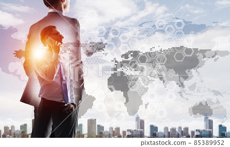 Concept of business success and control with confident boss against cityscape background 85389952