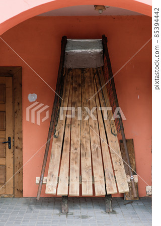 Old wooden wheels of coach ready for repair 85394442