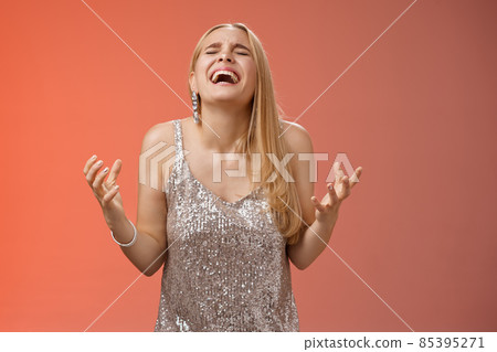 Relieved happy charming blond woman thank god shouting yes celebrating rejoicing win standing red background close eyes laughing happiness clench fists victory triumph gesture, dream came true 85395271