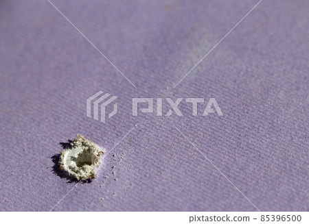 Hole in drywall left by screw or nail Hole in drywall left by screw or nail 85396500