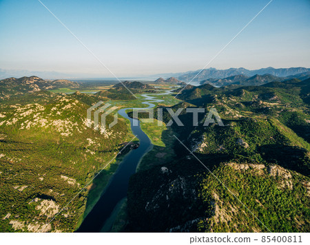 River Crnojevica meanders among green mountains 85400811
