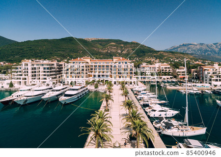 Pier leads to a luxurious, expensive hotel in the Porto resort. Montenegro 85400946