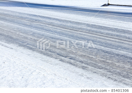 Snowy road where the temperature has dropped and it has become slippery Snowy road where the temperature has dropped and it has become slippery 85401306