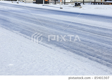 Snowy road where the temperature has dropped and it has become slippery Snowy road where the temperature has dropped and it has become slippery 85401307