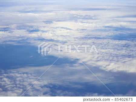 Cloudy blue sky taken from the airplane. 85402673