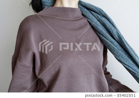 Female taking a muffler Female taking a muffler 85402851