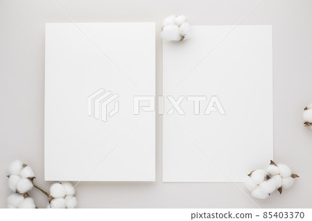 White invitation card mockup with a cotton flower on beige background, Minimal beige workplace composition, flat lay, mockup White invitation card mockup with a cotton flower on beige background, Minimal beige workplace composition, flat lay, mockup 85403370
