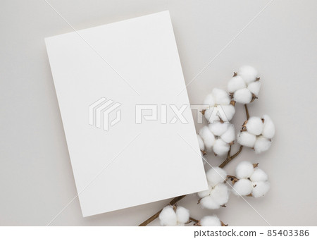 White invitation card mockup with a cotton flower on beige background, Minimal beige workplace composition, flat lay, mockup White invitation card mockup with a cotton flower on beige background, Minimal beige workplace composition, flat lay, mockup 85403386