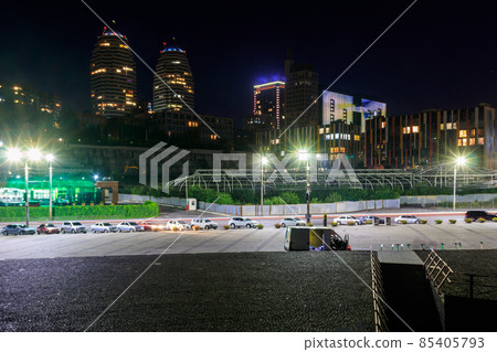 View of beautiful modern buildings, skyscrapers and towers of the night big city in Dnipro, Ukraine 85405793