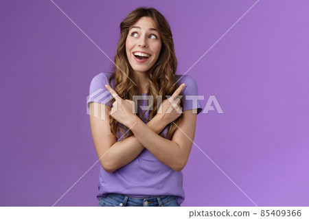Happy cheerful lively curly girl smiling broadly receive awesome opportunity study abroad choosing universities cross hands sideways pointing left right grinning amused entertained purple wall Happy cheerful lively curly girl smiling broadly receive awesome opportunity study abroad choosing universities cross hands sideways pointing left right grinning amused entertained purple wall 85409366