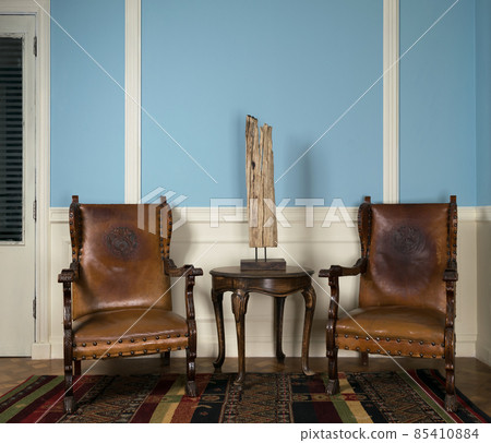 Two wooden retro armchairs, table lamp and round coffee table 85410884