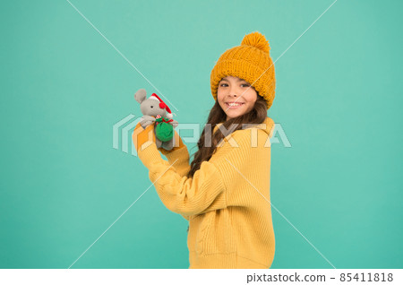 Happy childhood. Girl child hold rat or mouse toy.  85411818