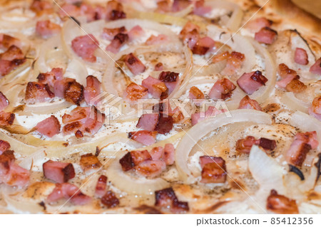 Close-up on fresh traditional flammkuchen. Close-up on fresh traditional flammkuchen. 85412356