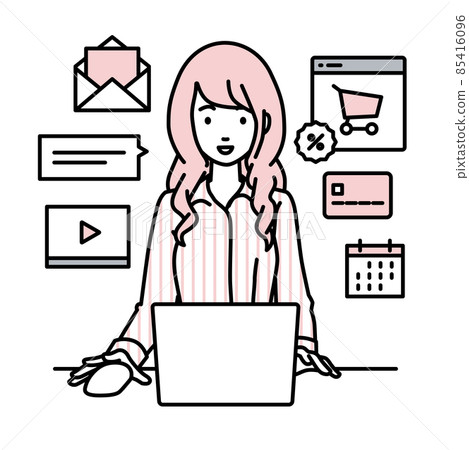 A woman in a blouse sitting at a desk and doing an online shop or marketing job on a PC 85416096