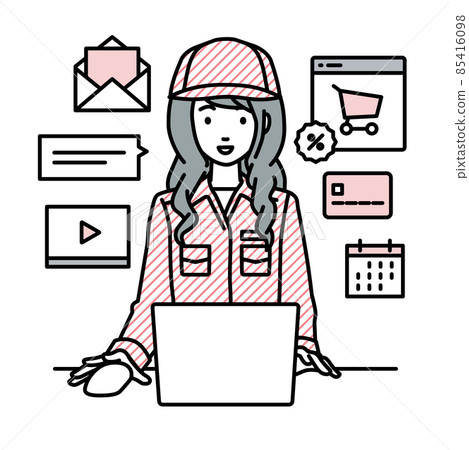 A female worker sitting at a desk and doing an online shop or marketing job on a PC 85416098