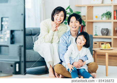 Young family watching tv 85416872