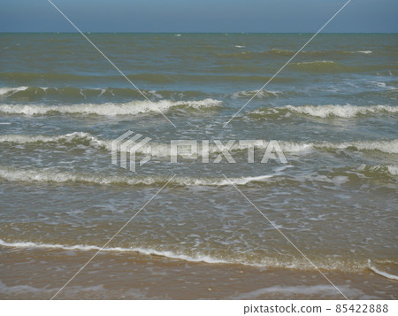 Ocean wave with white bubbles, Green sea water and Nautical landscape background. Seaside horizon view, Waves and the beach Ocean wave with white bubbles, Green sea water and Nautical landscape background. Seaside horizon view, Waves and the beach 85422888