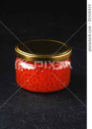 Jar with pink salmon red caviar 85426424