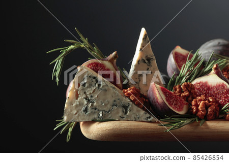 Blue cheese with figs, walnuts, and rosemary. Blue cheese with figs, walnuts, and rosemary. 85426854