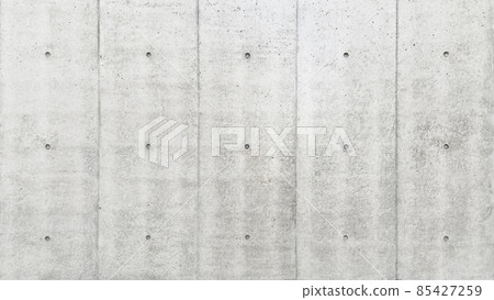 Horizontal background image of a light gray concrete wall with separate holes Horizontal background image of a light gray concrete wall with separate holes 85427259