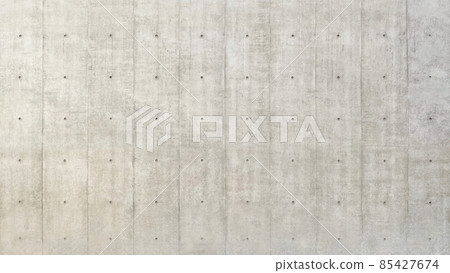 Horizontal background image of a wide gray concrete wall with separate holes 85427674