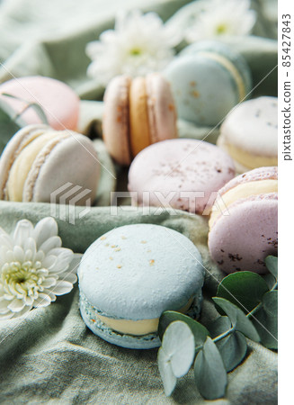 Beautiful colorful tasty macaroons on a textile background Beautiful colorful tasty macaroons on a textile background 85427843