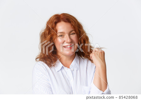 People, emotions and lifestyle concept. Close-up of carefree and happy mother, middle-aged redhead woman laughing and smiling pleased, concept of positivity and joy, white background People, emotions and lifestyle concept. Close-up of carefree and happy mother, middle-aged redhead woman laughing and smiling pleased, concept of positivity and joy, white background 85428068