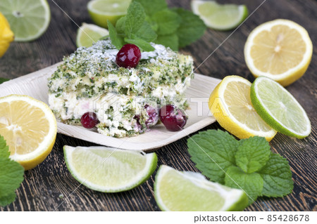 green cake with cream and lime green cake with cream and lime 85428678