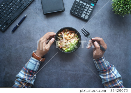 top view of bowl of fresh boiled vegetables on office desk top view of bowl of fresh boiled vegetables on office desk 85429073