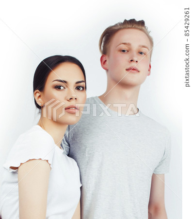 modern hipster guys together couple diverse nations, asian girl and caucasian blond boy isolated on white background, lifestyle people concept 85429261